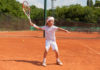 boy training tennis