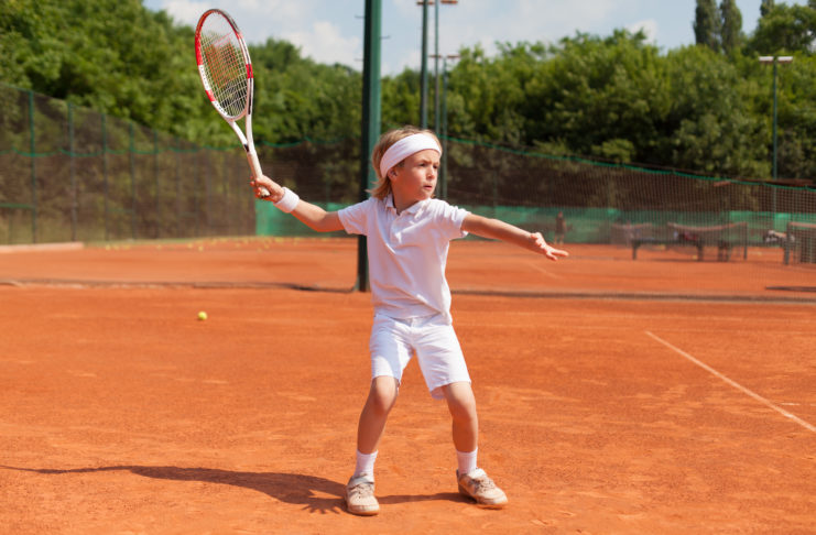 boy training tennis